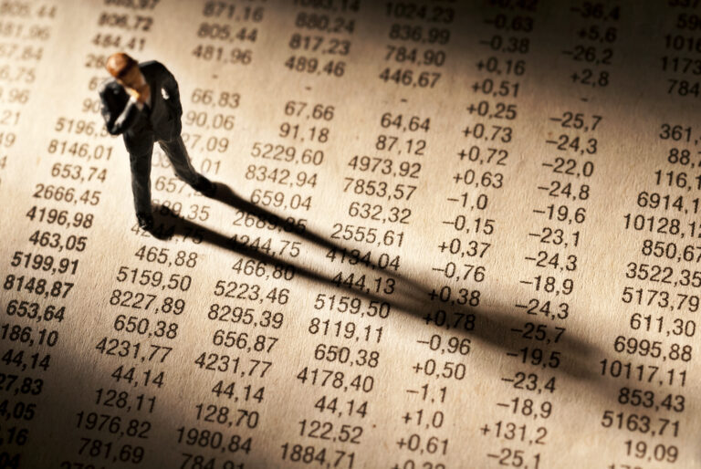 Broker,Stands,On,Stock,Price,Chart,,And,Casts,A,Long