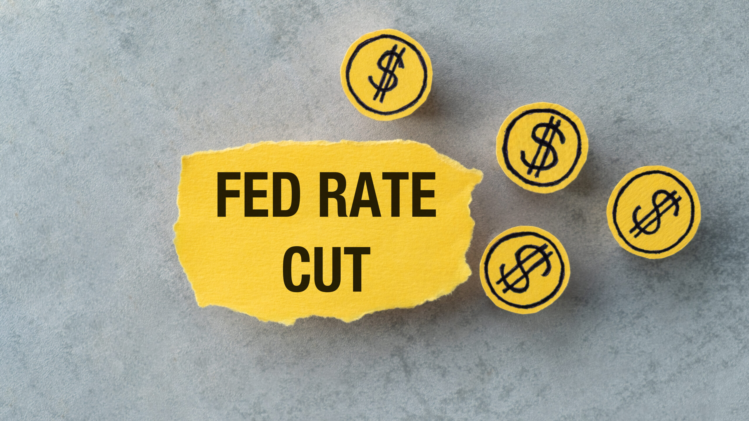 Fed Rate Cut on top of a downward falling graph, macro closeup view. Concept on FOMC adjusting rates to address inflation and the .